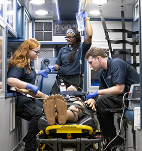 Students train in emergency medical science.